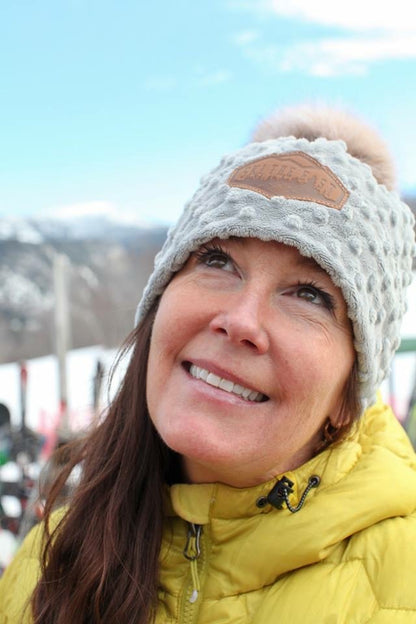Kat Whalen, Cape Cod founder of Rippin Kiten Hats, wearing a custom Apres ski hat 